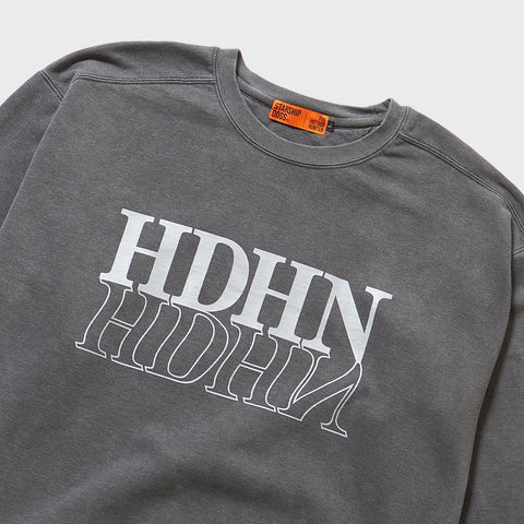 Product Print Section Zoomed In: A cool sweatshirt in black with a dark grey texture. An orange brand tag of STARSHIP DOGS is stitched inside the collar.