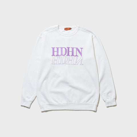 Product Front Photo: A cool sweatshirt in white, dyed using direct reactive (direct response dyeing) method. On the chest, a large HDHN (abbreviation for HOTDOG HUNTER) logo is silk-screen printed, giving the impression of a reflection on water and a mirror. The print is in light purple and is single-colored.